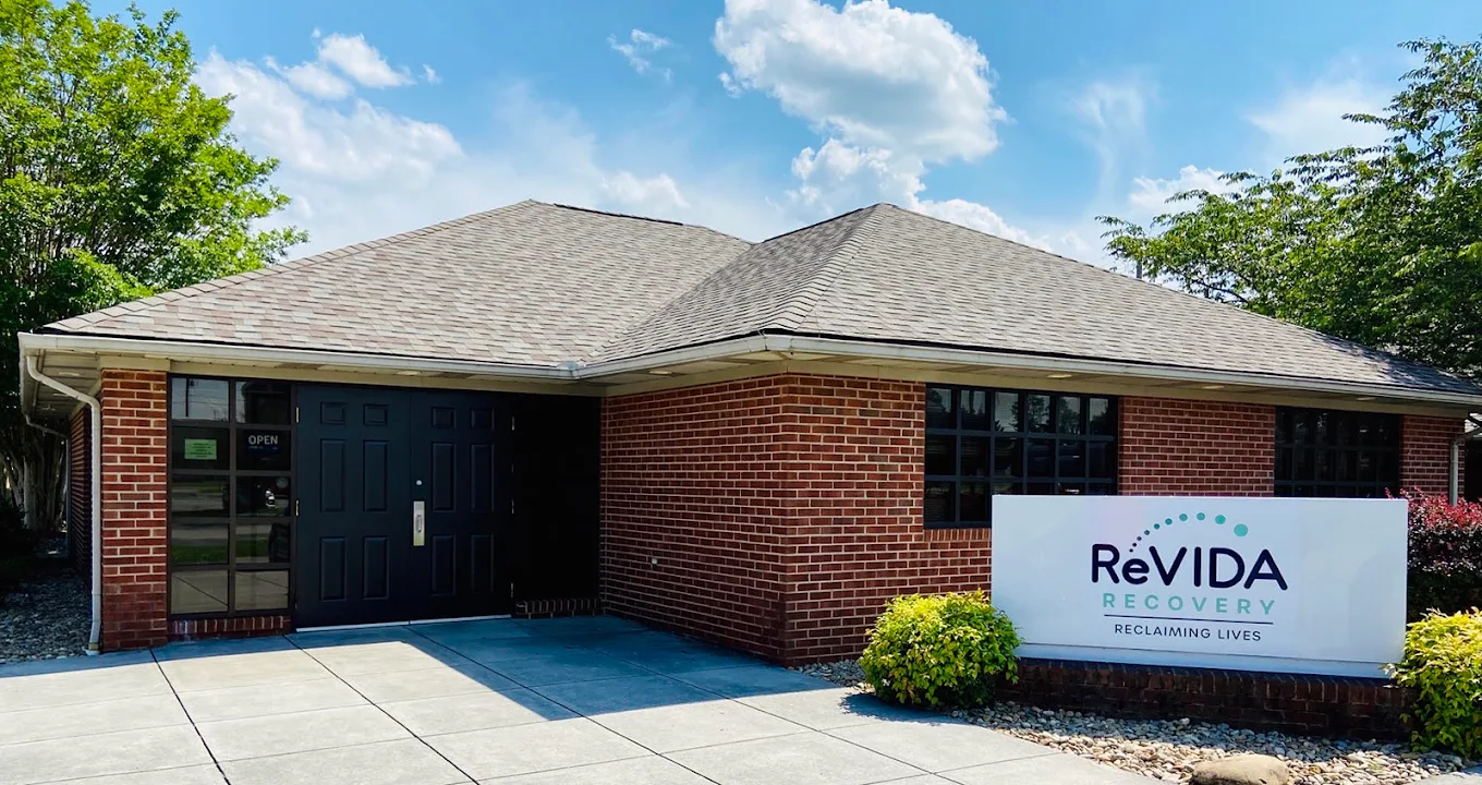 Brick recovery center exterior with entrance and signage