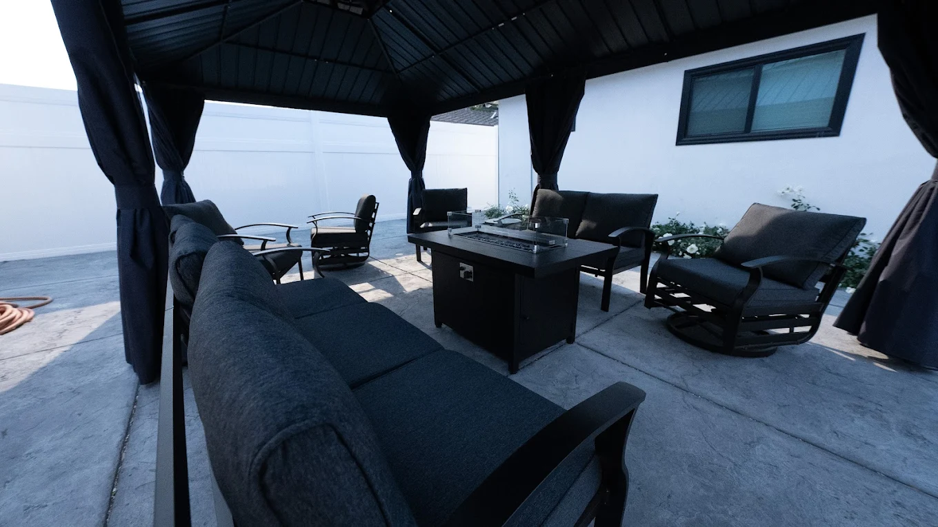 Covered patio seating with outdoor fire table