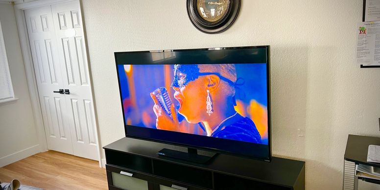 TV playing music video in a cozy lounge setup