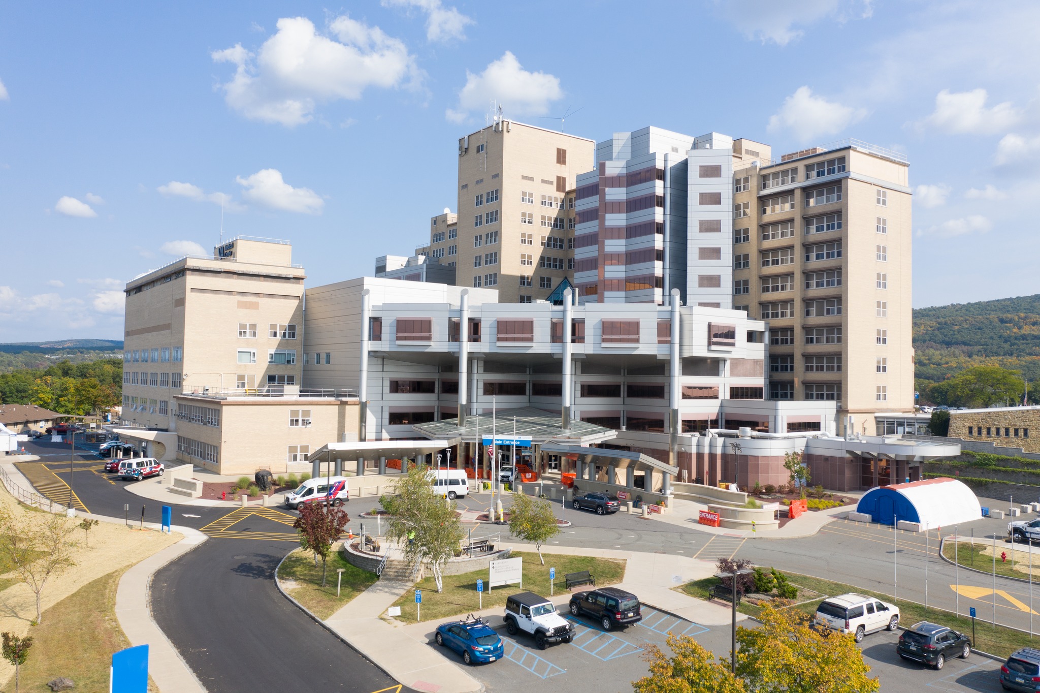 Multi-story VA medical center with parking lot and entrance canopy