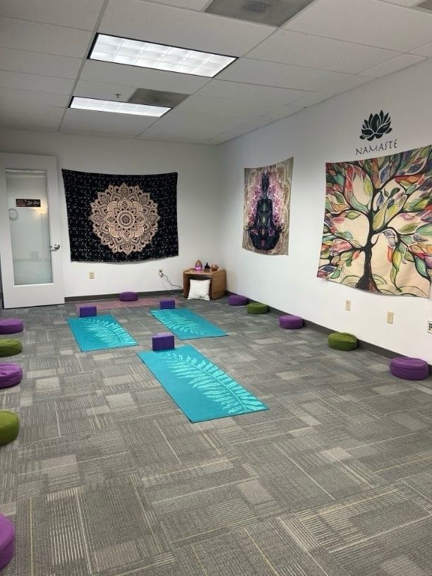 Yoga mats and cushions set up in a peaceful room