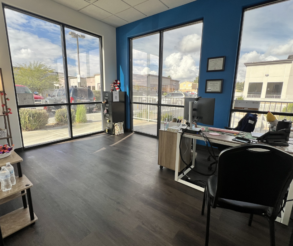 Staff office with desk and large front windows