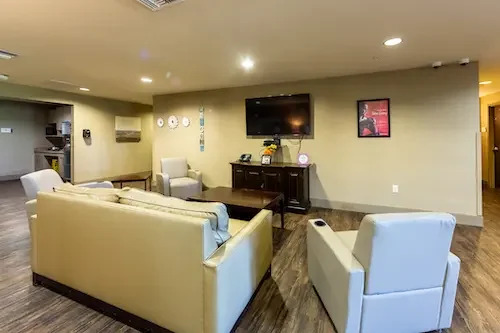 Comfortable lounge area with sofas and TV