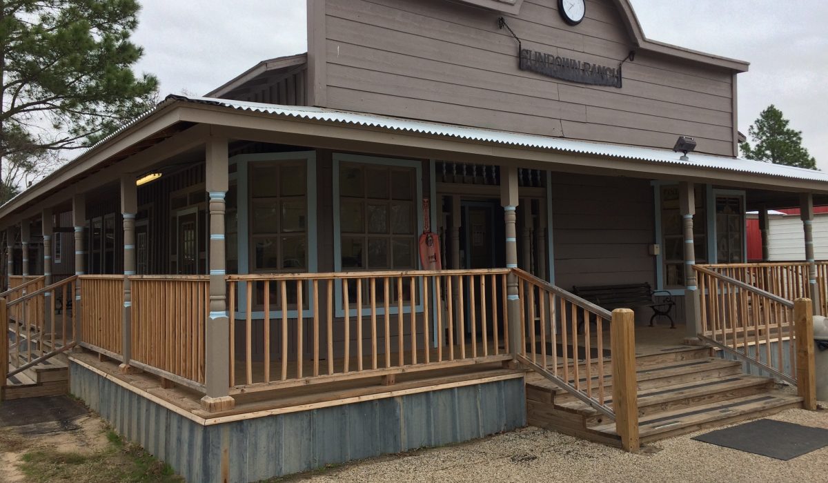 Main building entrance with covered porch at Sundown Ranch
