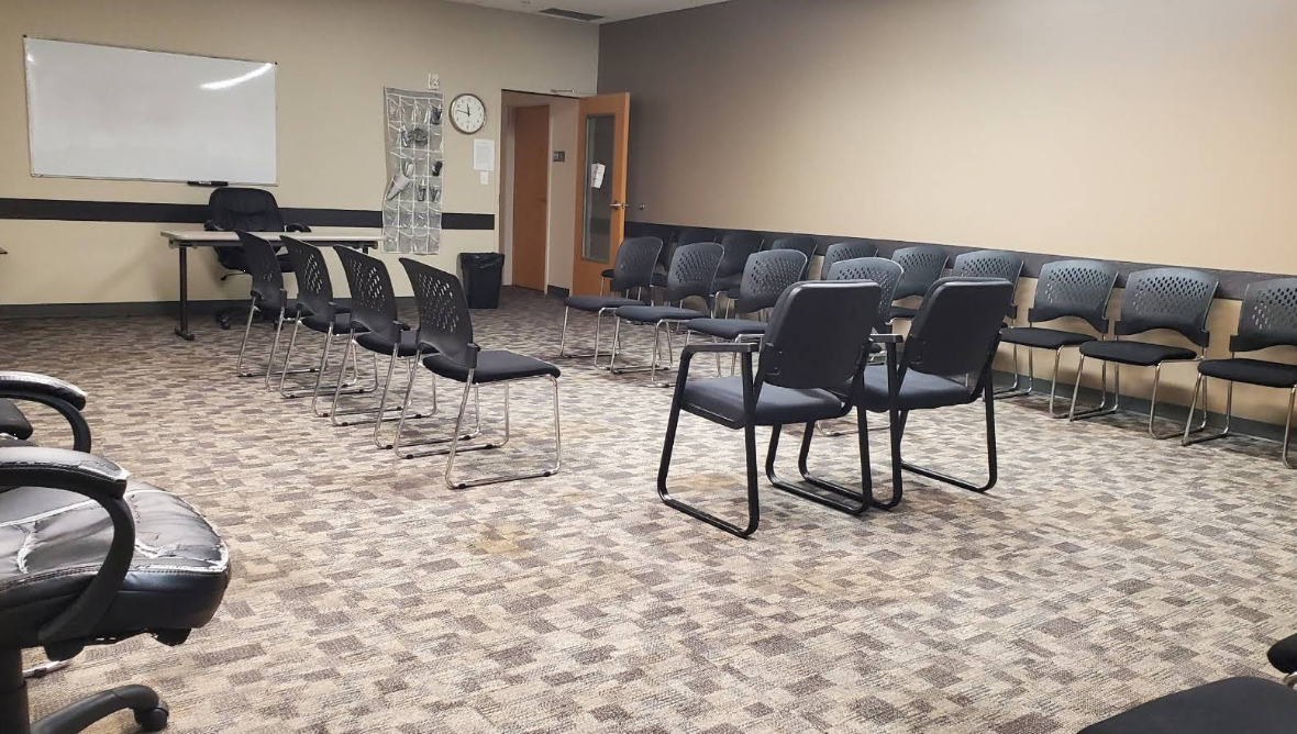 Group therapy room with chairs arranged in a circle