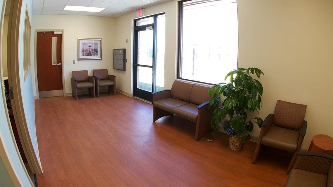 Assessment waiting area with chairs and natural light