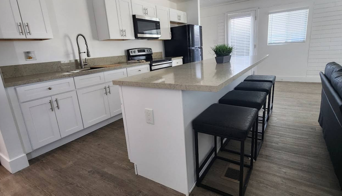 Shared kitchen with island seating and modern appliances