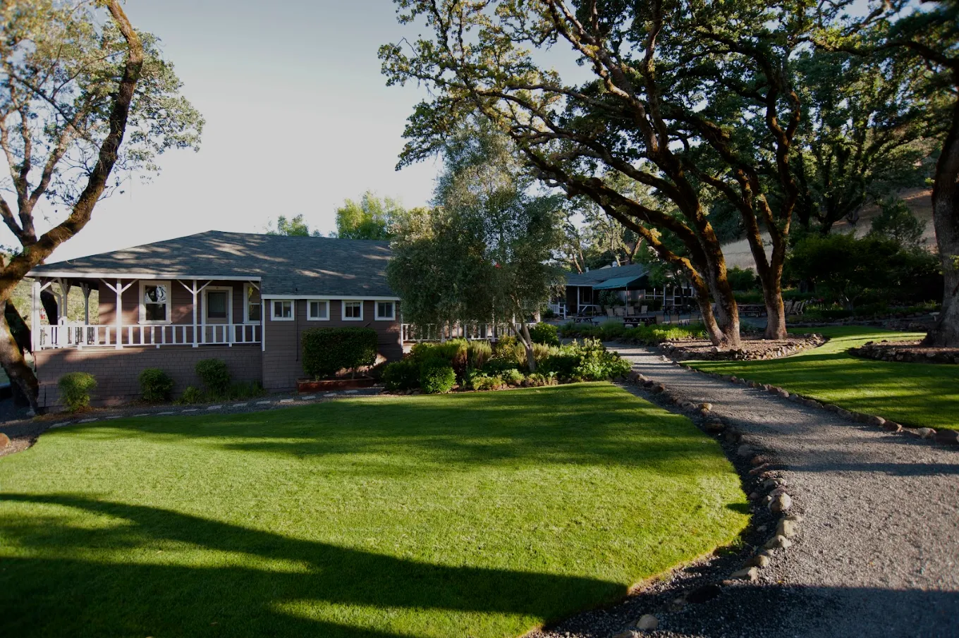 Spacious green lawn with pathway leading to the building