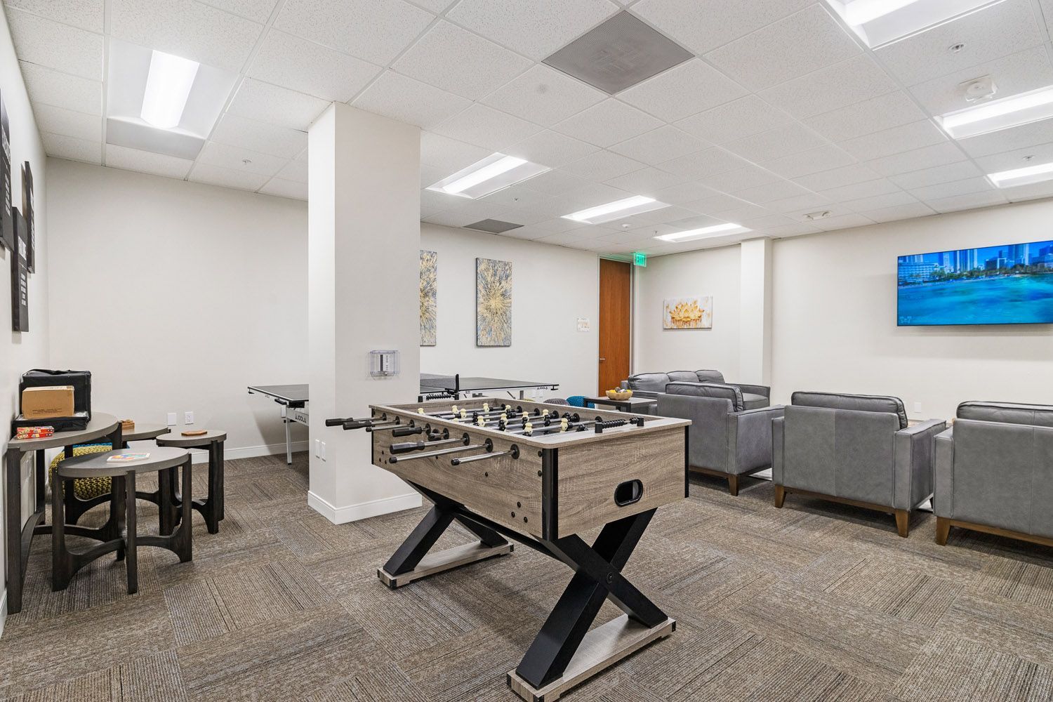 Recreation room with foosball table and sofas