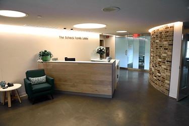 Reception desk with wood accents and modern lighting