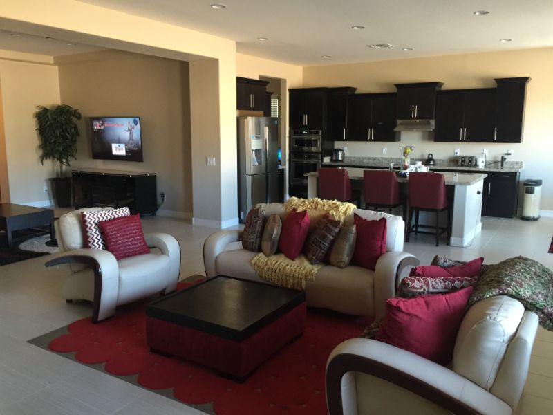 Open living area with sofa set and view of kitchen