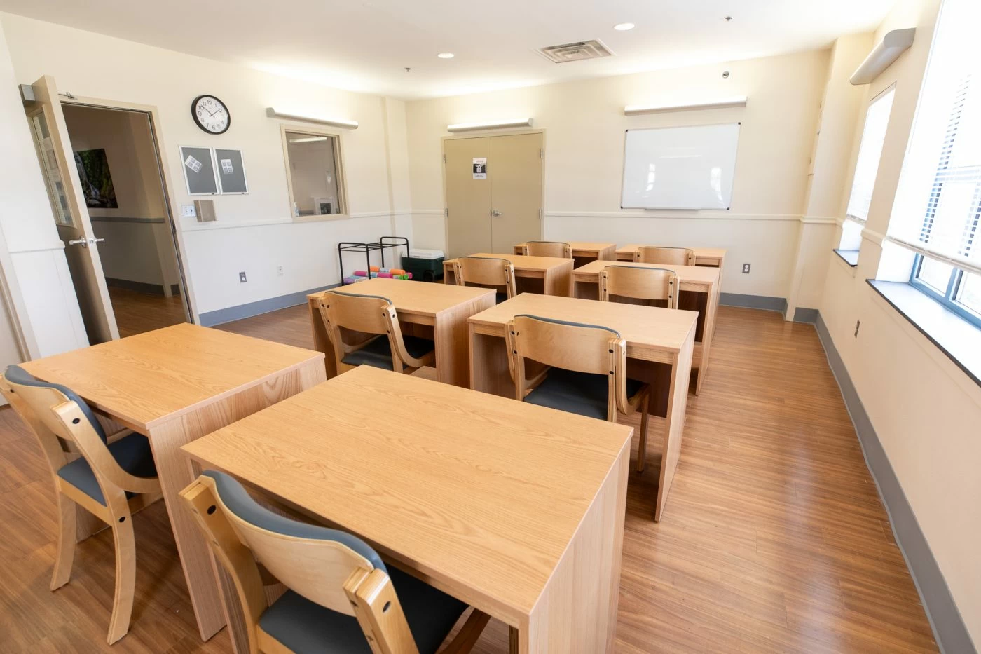 Classroom with desks, chairs, and whiteboard