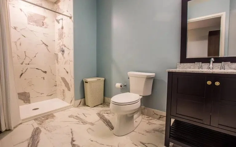 Modern bathroom with marble shower and vanity