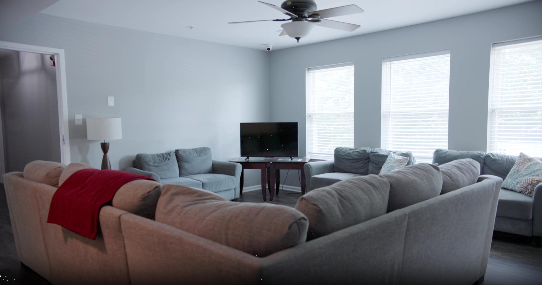Indoor lounge with sofas and TV for relaxation and group activities