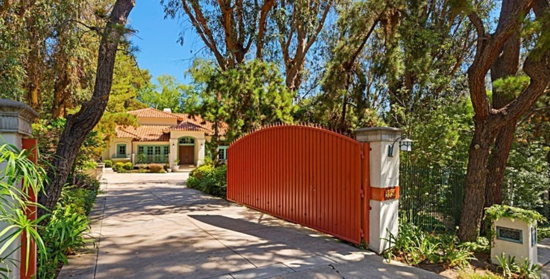 Facility driveway with a red gat.