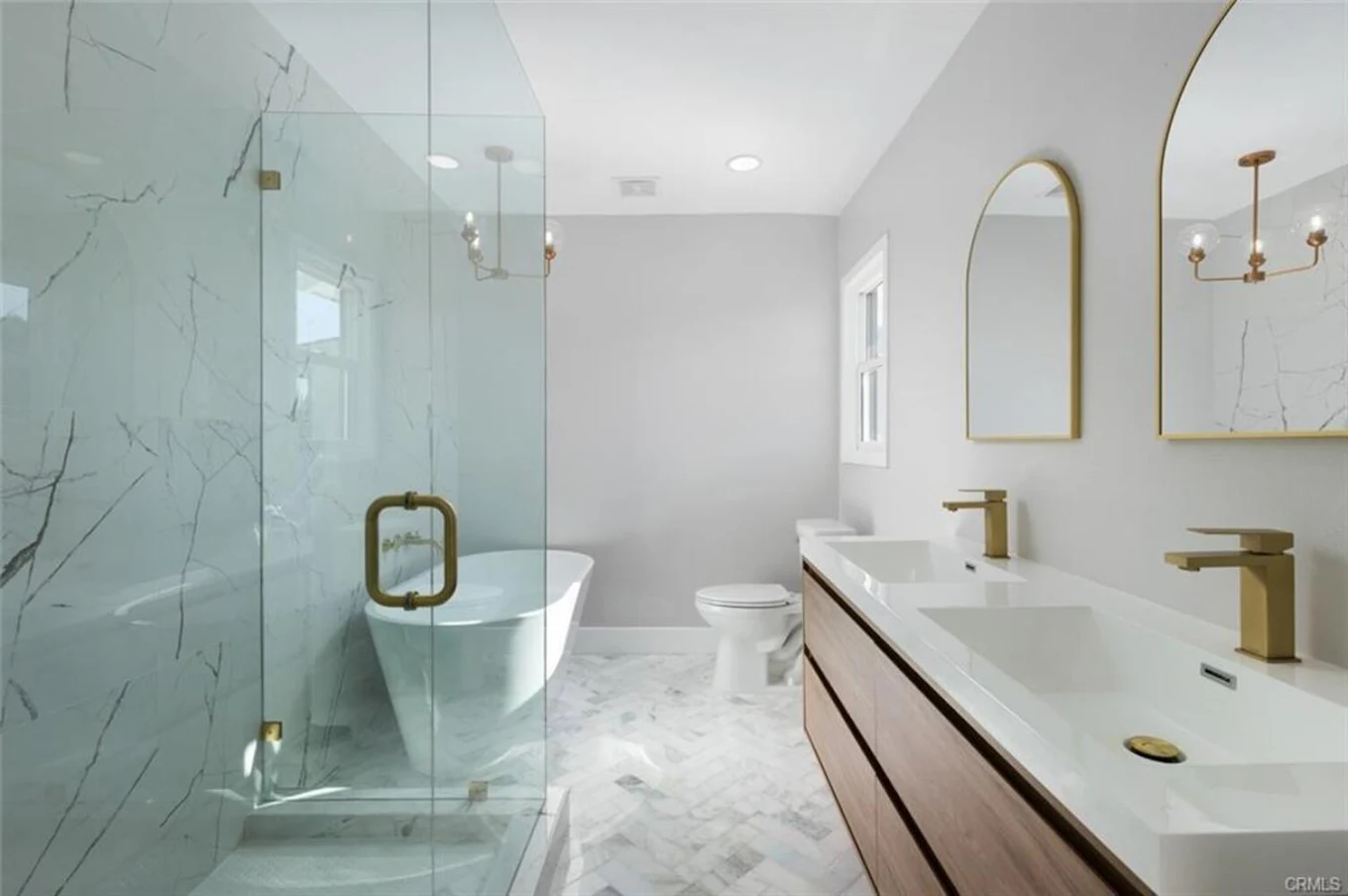 Modern bathroom with glass shower and double vanity