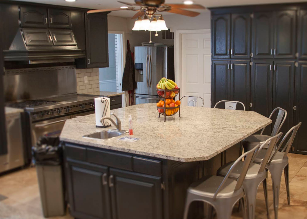 Shared kitchen with island seating and modern appliances