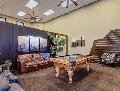 Recreation room with pool table and lounge seating