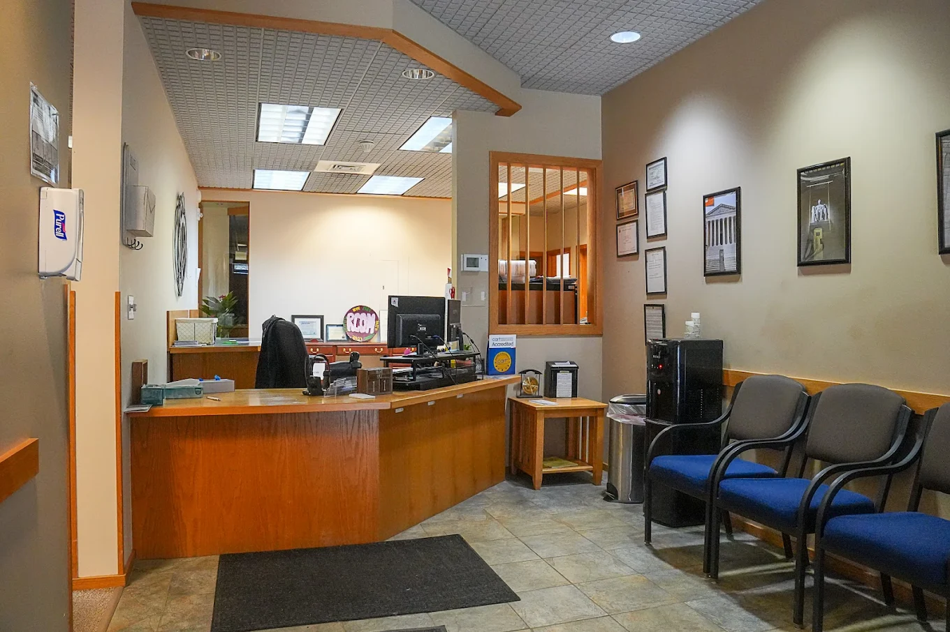 Reception desk and chairs near entrance
