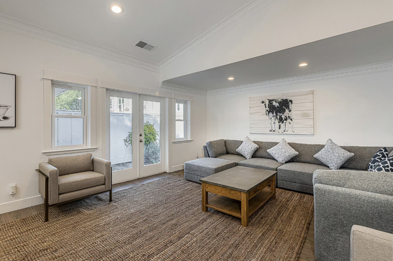 Living room with sectional sofa and large windows