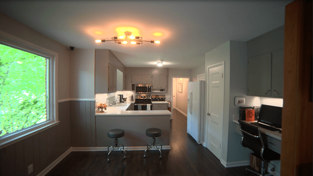 Modern kitchen with bar seating and stainless appliances