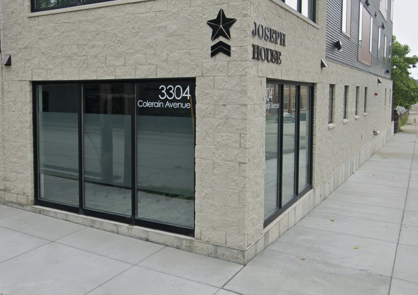 Joseph House entrance with glass doors and star logo