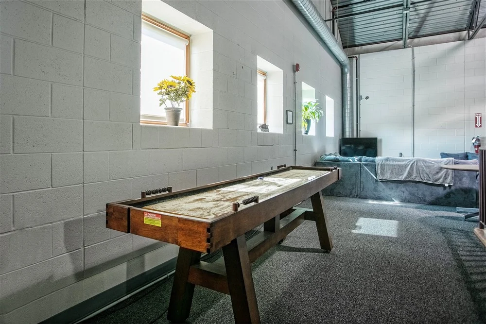 Recreation room with foosball table and workout equipment