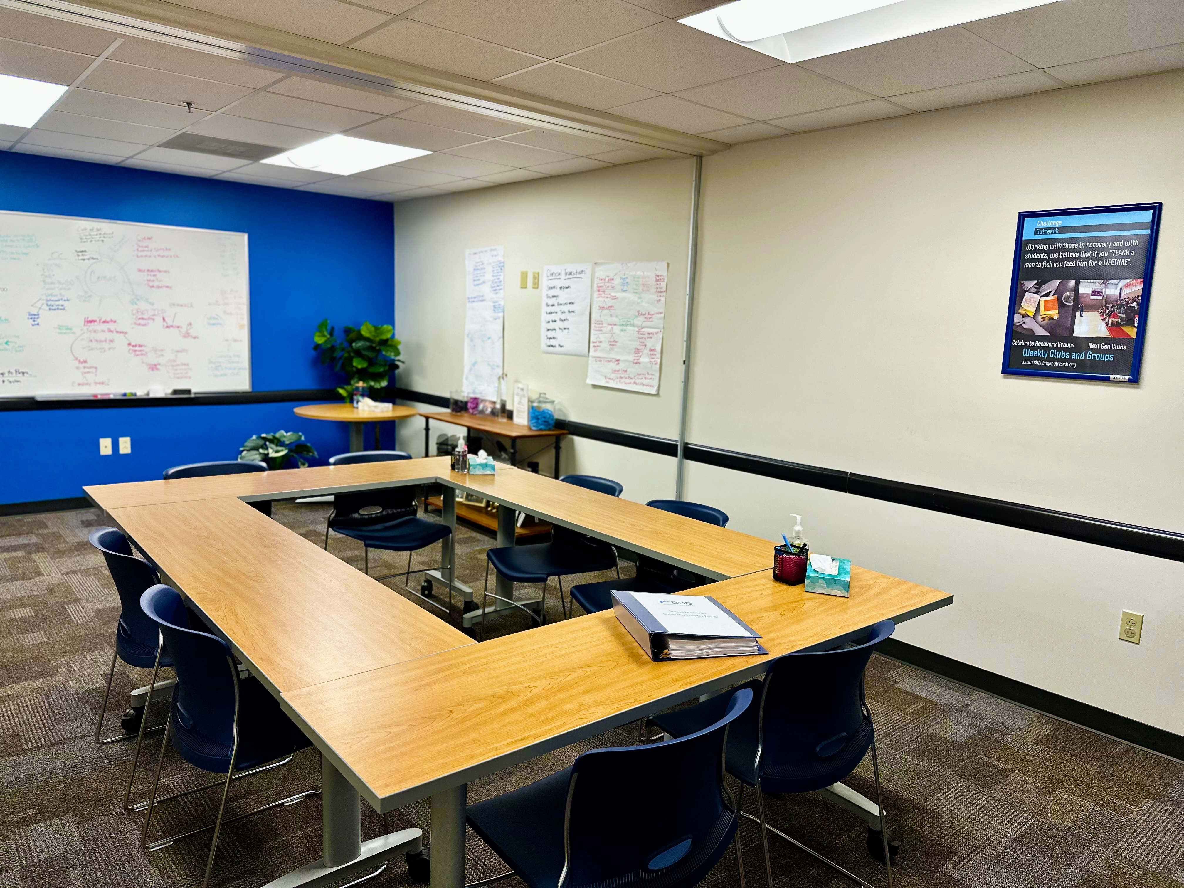 Group therapy room with tables arranged for meetings