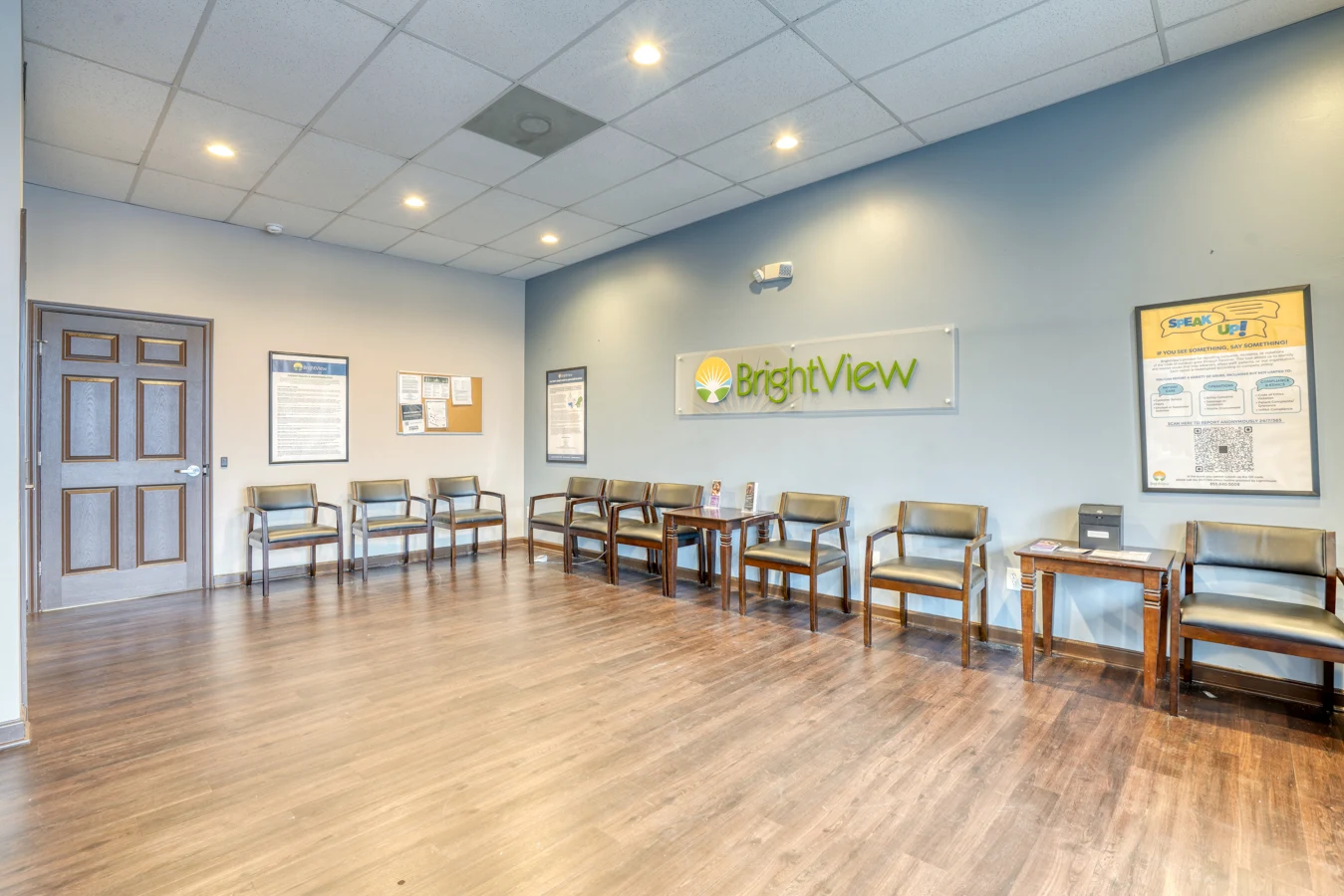 BrightView waiting area with rows of chairs and wall-mounted facility sign
