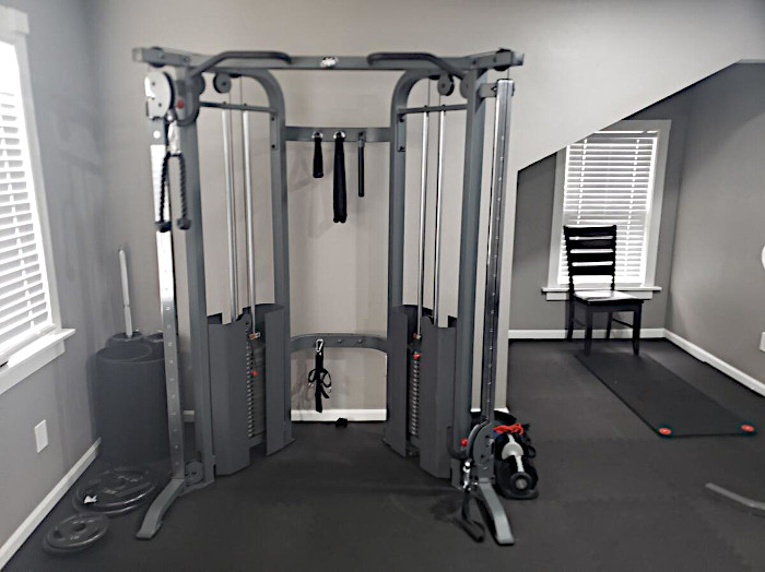 Indoor gym setup with strength training equipment