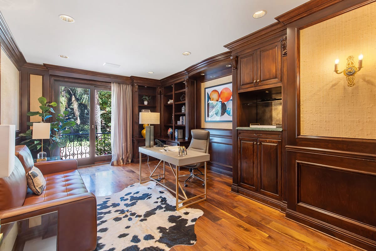 Private executive office with desk, seating, and wood finishes