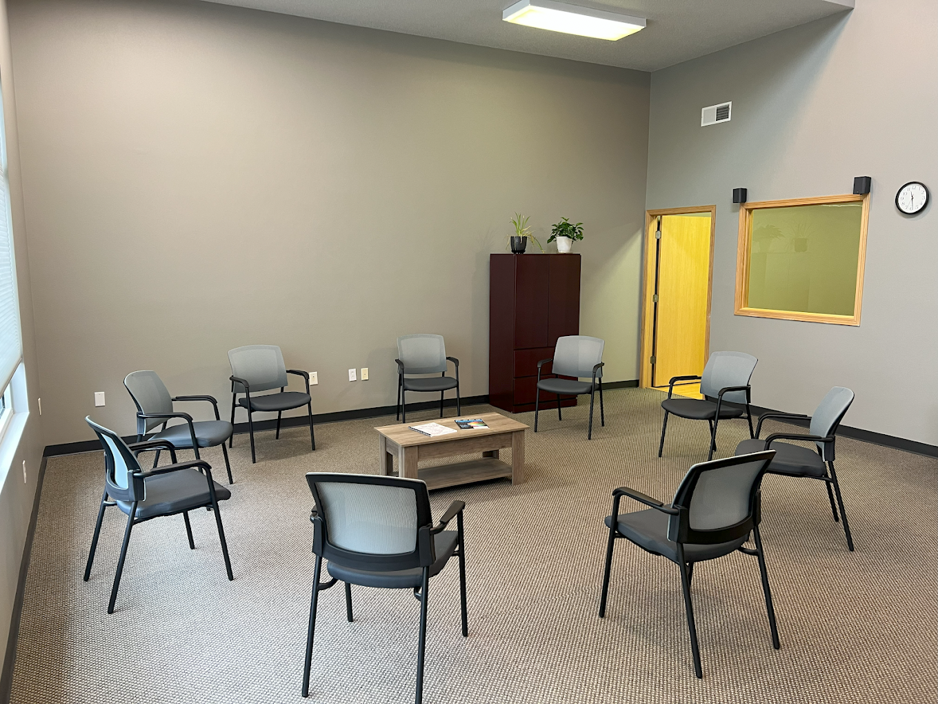 Group therapy space with chairs arranged in a circle