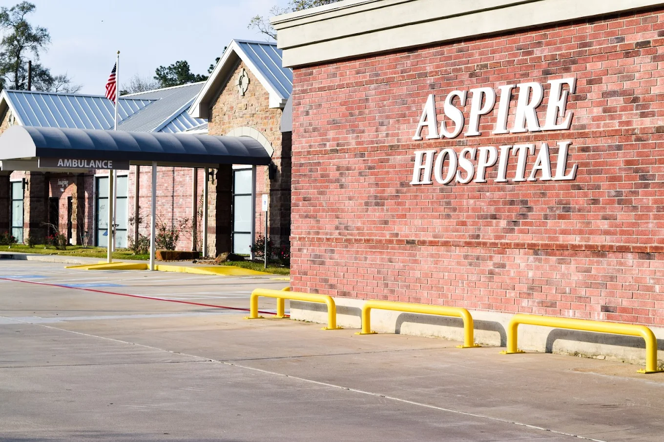 View of ambulance canopy and hospital sign wall