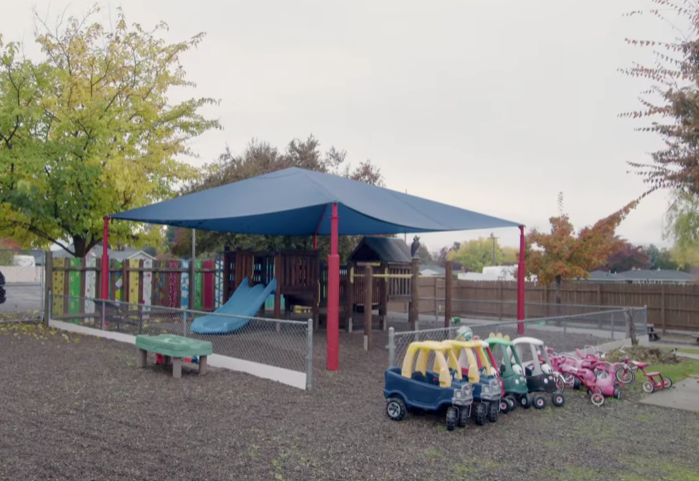 Outdoor playground with slides and toy cars