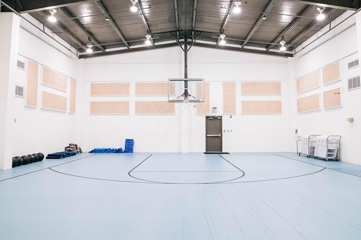 Indoor basketball court with fitness equipment