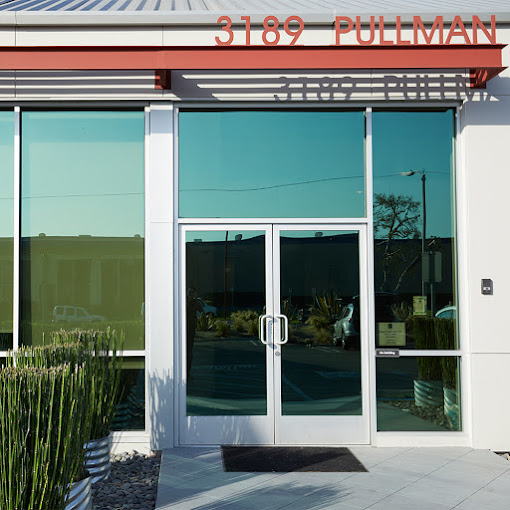 Entrance walkway with glass doors.