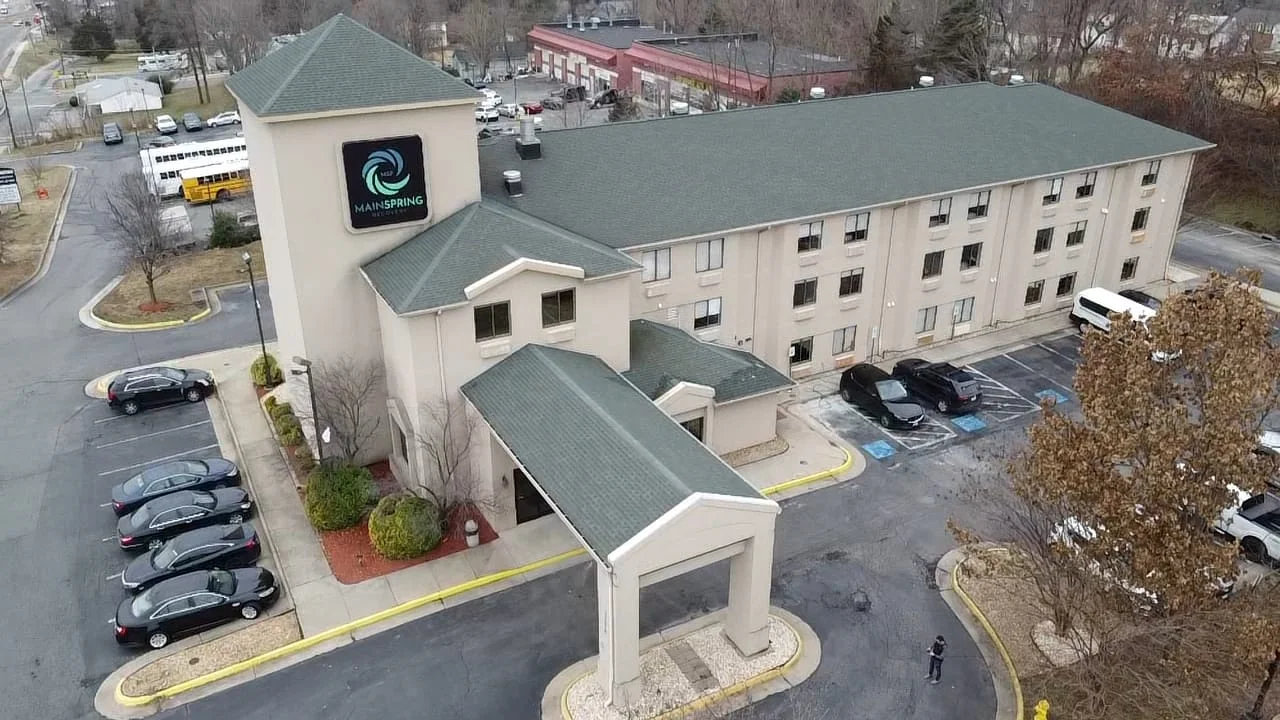 Drone view of Mainspring Recovery facility with parking lot and surrounding streets