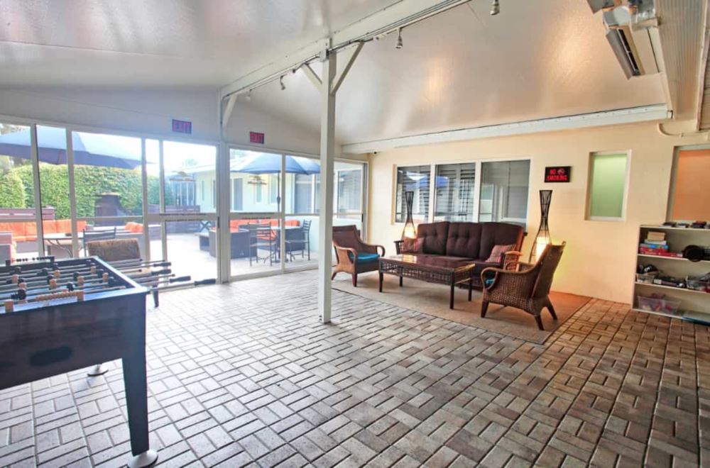 Indoor space with foosball table and wicker seating