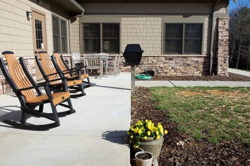 Patio with rocking chairs and outdoor dining area