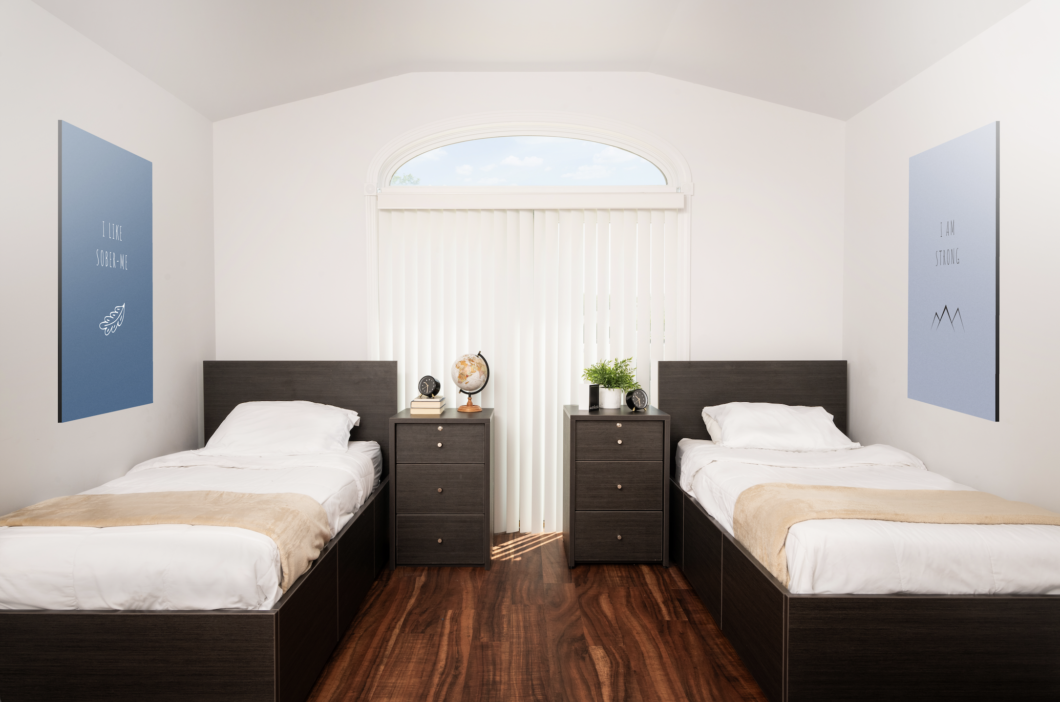 Two twin beds with nightstand in cozy shared room