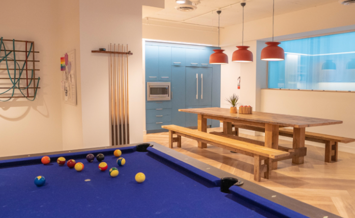 Recreation room with pool table, picnic tables, and dartboard