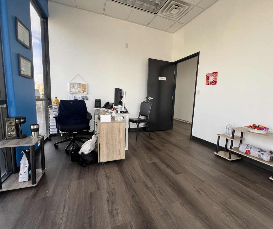 Office workspace with desk and visitor seating