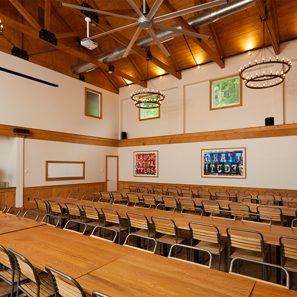Dining hall with tables and chairs.