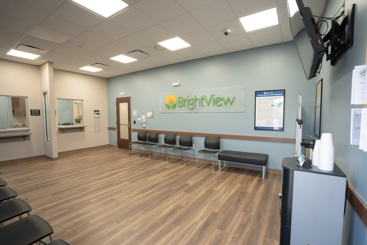 Spacious waiting room with chairs and BrightView wall sign