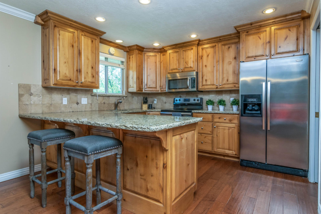Modern kitchen with wood cabinets and granite counters