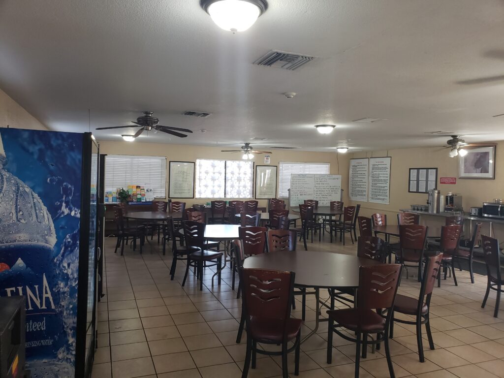 Large dining area with round tables and chairs