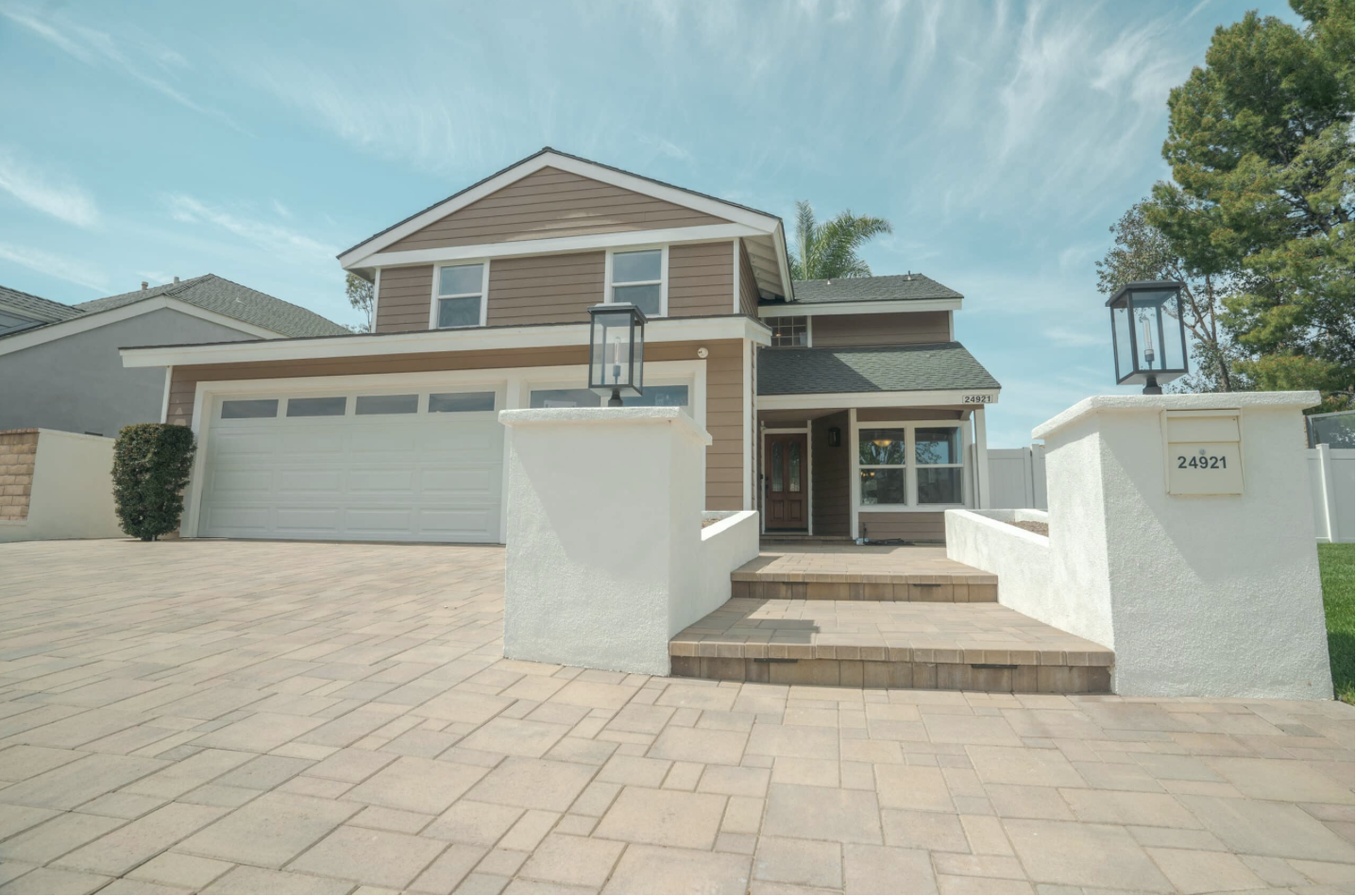 Facility exterior with paved entrance and parking.