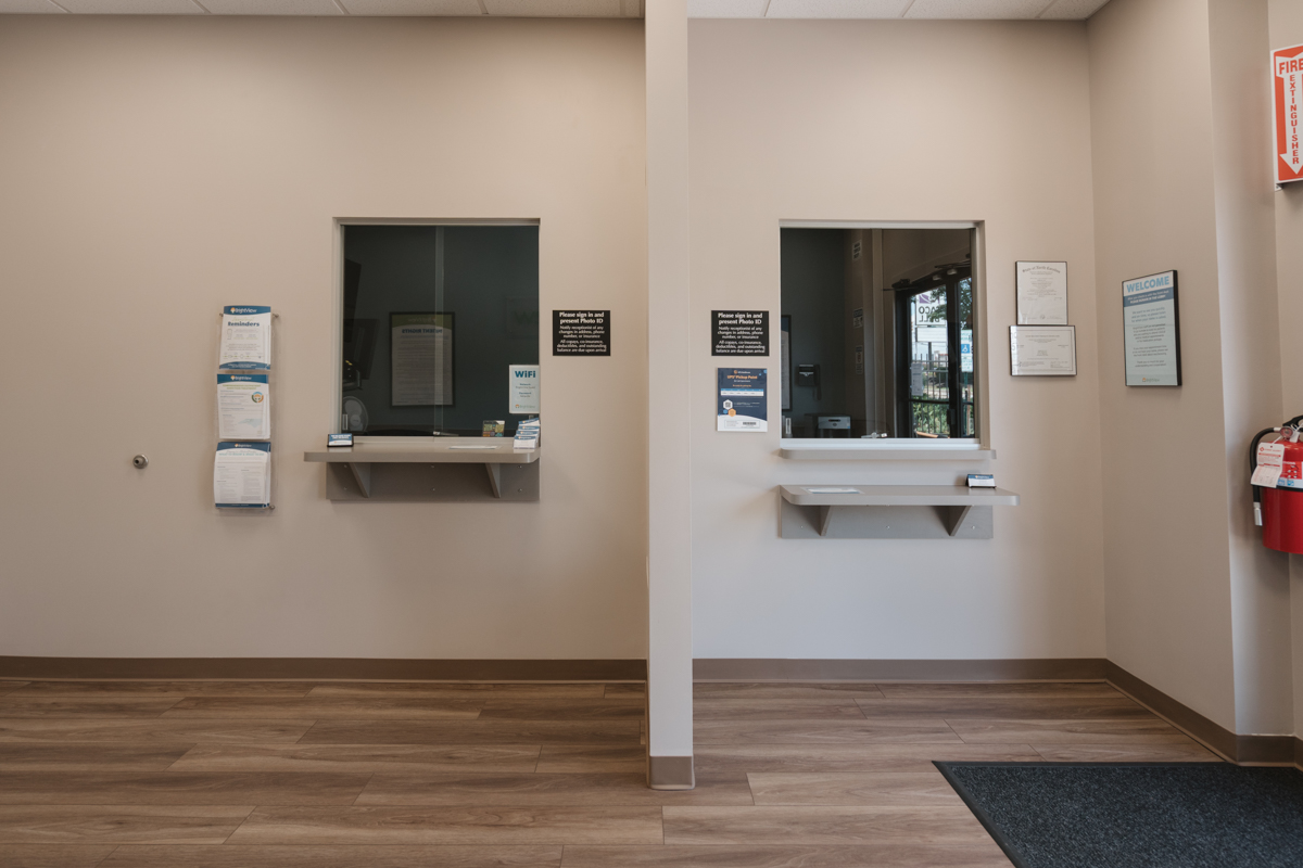 Front desk area with two patient service windows