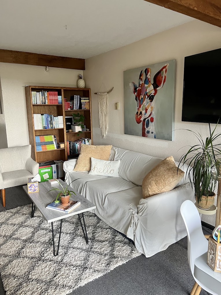 A reading and relaxation area with bookshelves and a sofa.