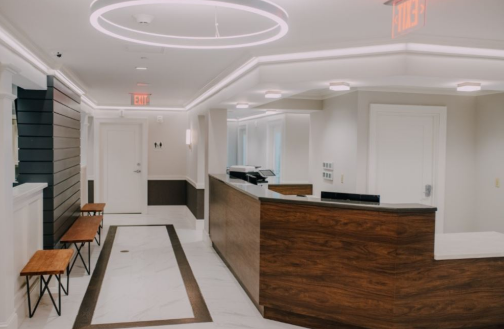 Modern reception desk in a clean clinical hallway